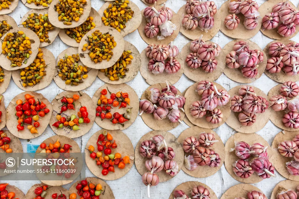 Raw garlic and other spices on traditional food street market