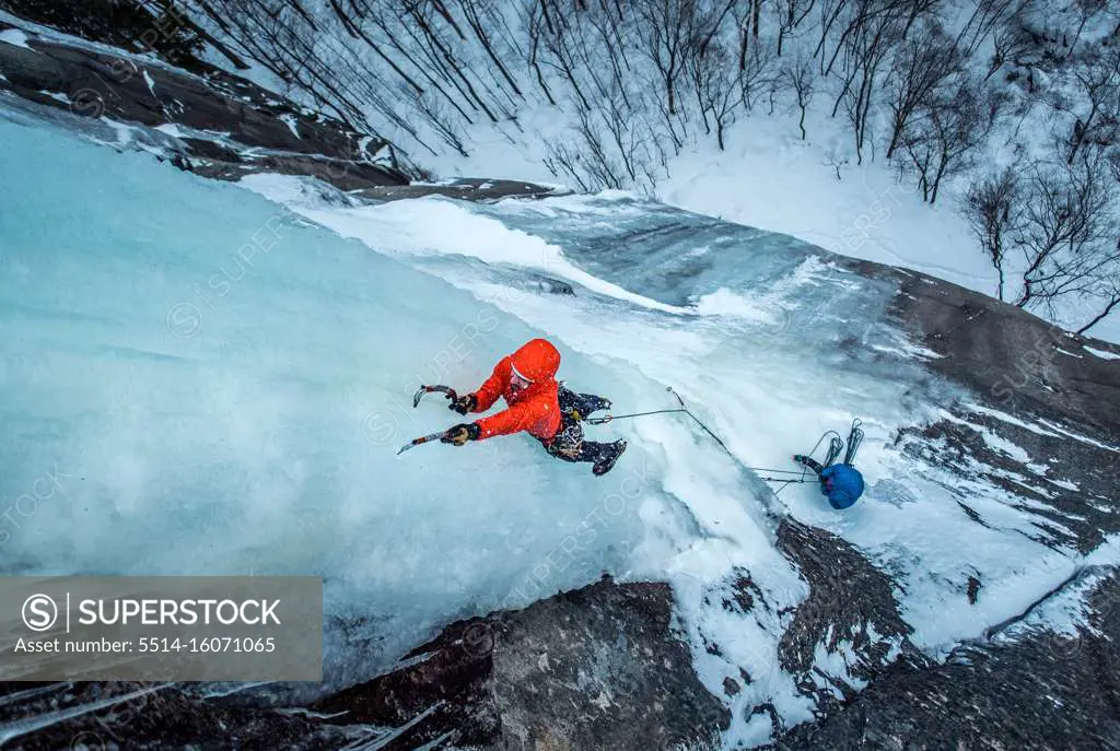 Man ice climbing on Cathedral Ledge in North Conway, New Hampshire