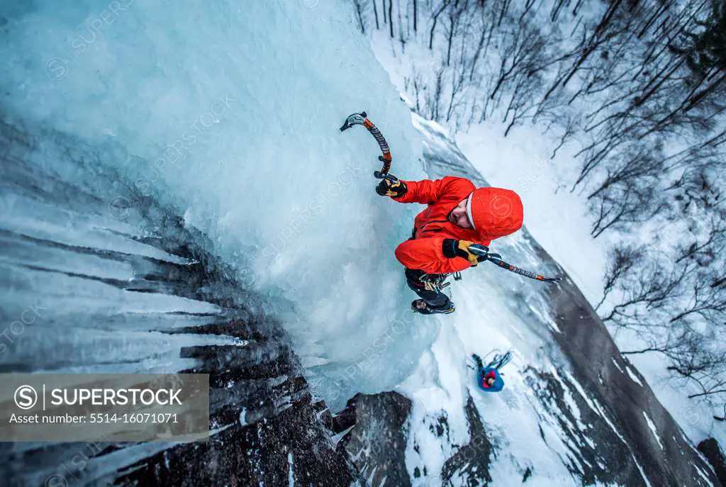 Man ice climbing on Cathedral Ledge in North Conway, New Hampshire