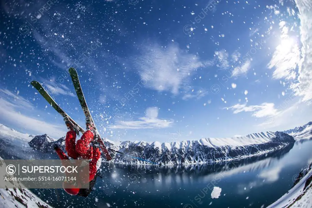 Man performing flip on skis in Svalbard