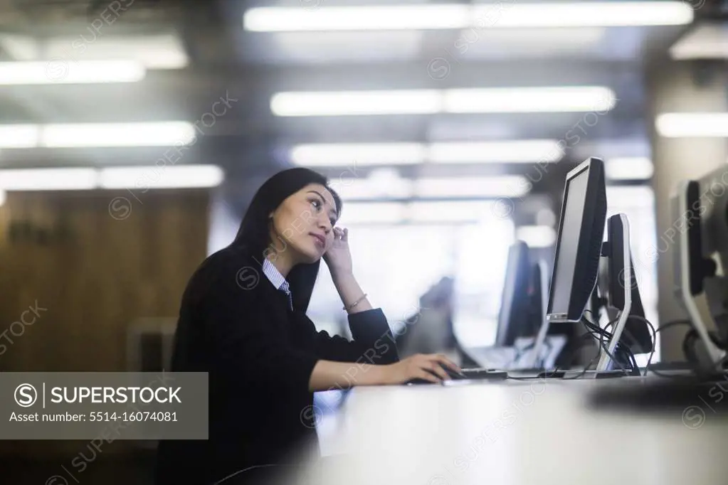 young asia woman with paper in an office working