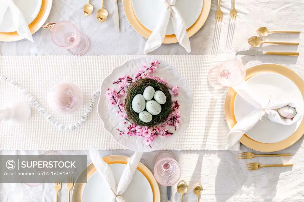 overhead shot of easter tablescape with cherry blossoms