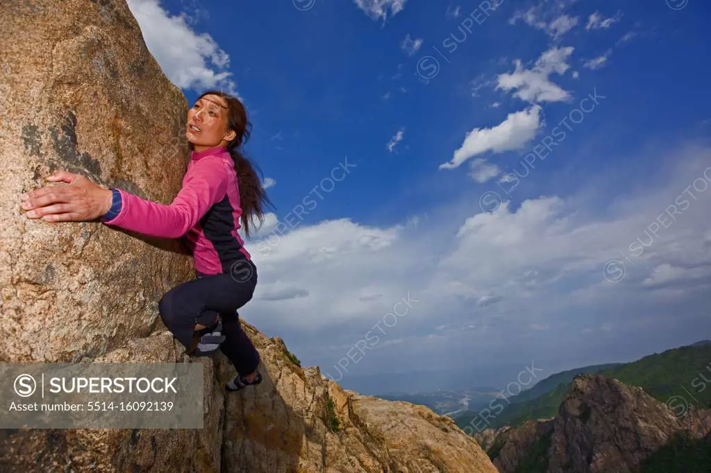 Female climber bouldering at Seroksan national park in South Korea