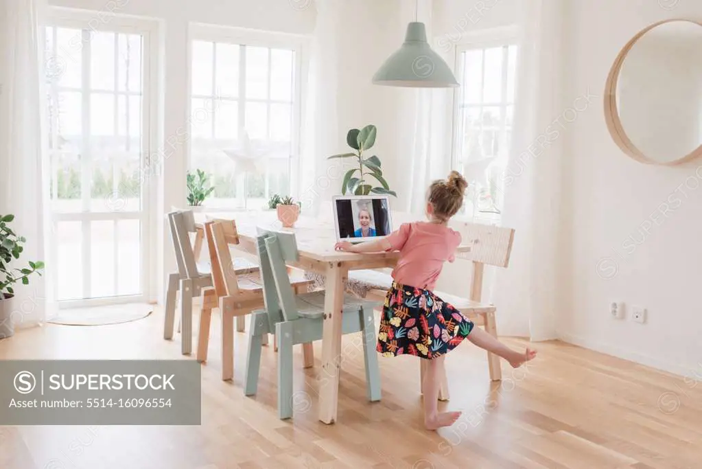 girl having a video call with a nurse in hospital dancing for her