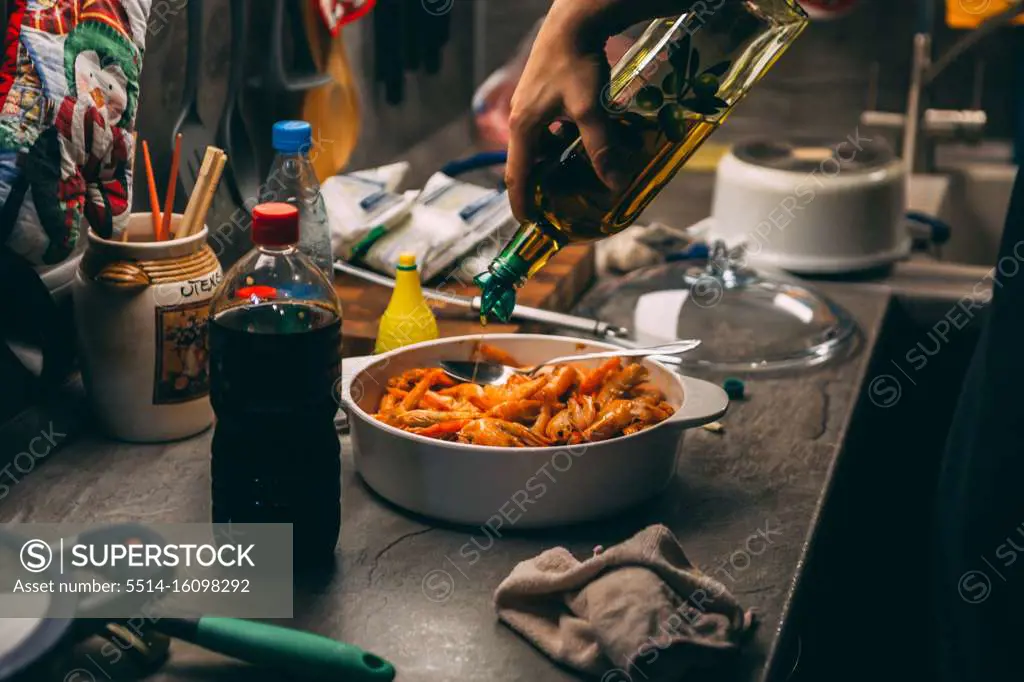 fried until golden brown tiger shrimp are ready in a pan and serving at the table