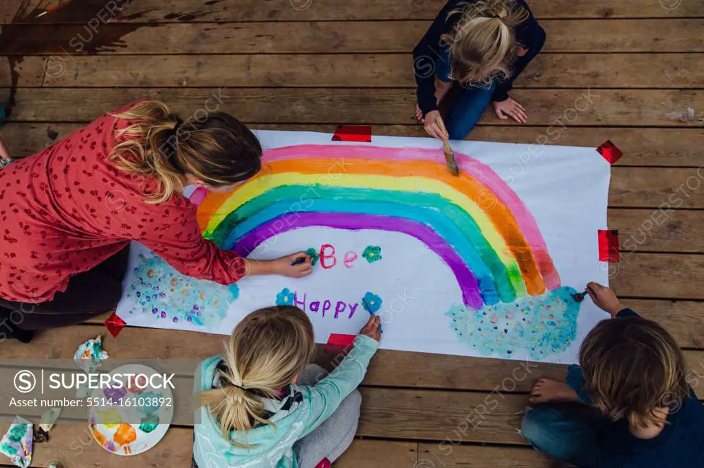 Children painting an uplifting sign for Covid-19 Quarantine