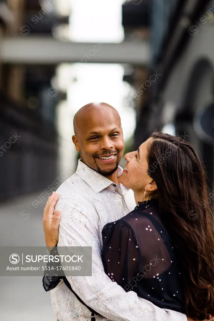 Late Forties Couple Embracing & Smiling in San Diego