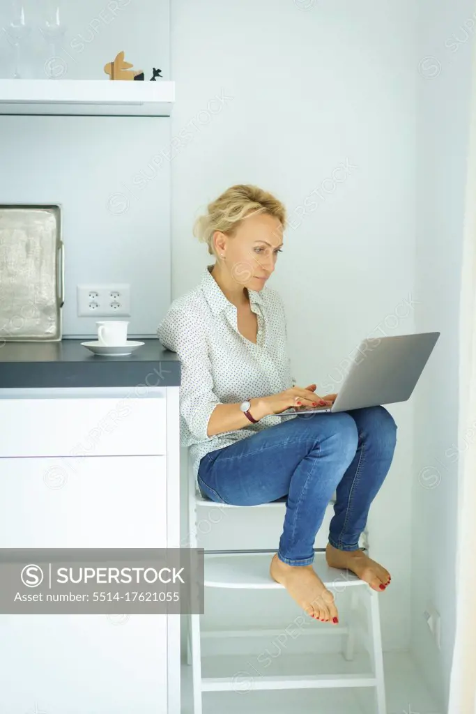 Women working at home with Laptop. Home office