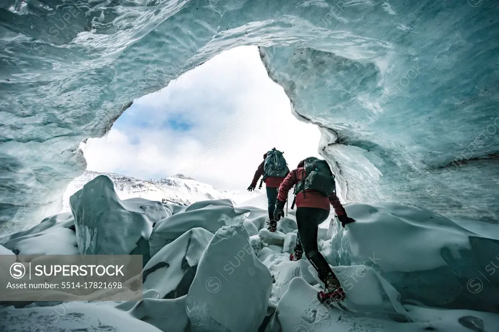 Mountaineers Exploring Inside Of Glaciers In Jasper