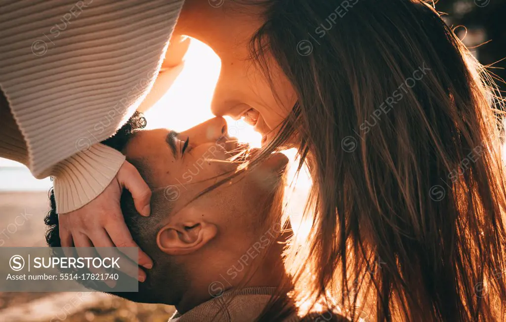 Lovely Shot Of A Young Couple In Love At Sunset