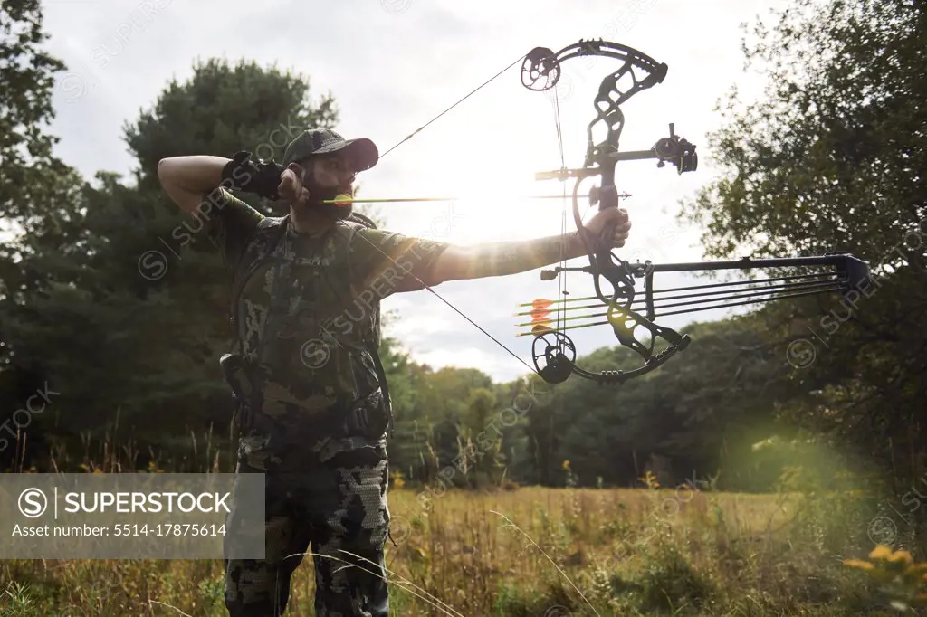 Bow Hunter drawing his bow in the Appalachian Mountains