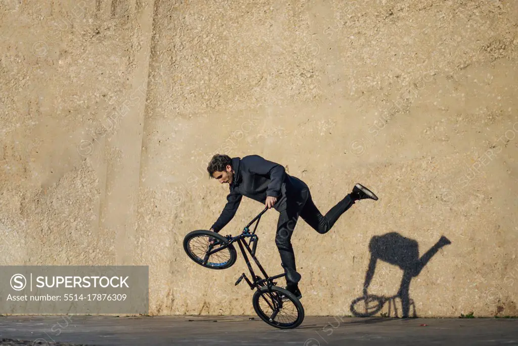 Man practicing tricks with the bmx bike in the city