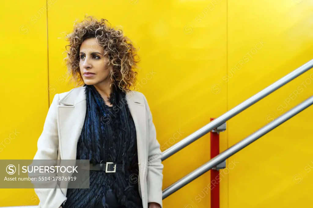 portrait of woman on yellow background