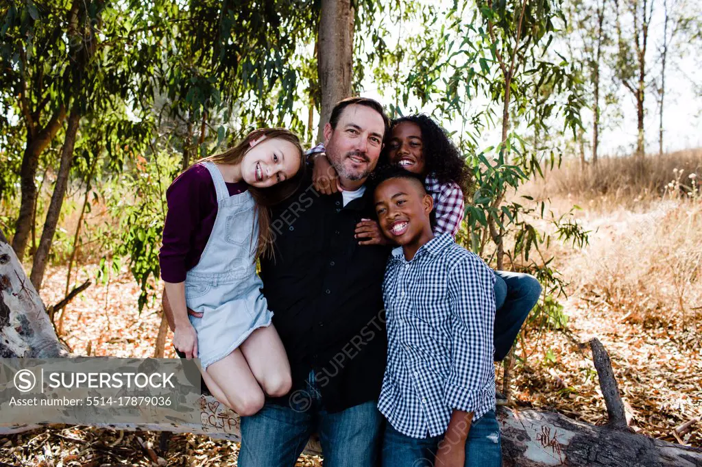 Dad & Kids Hugging & Smiling for Camera at Park in Chula Vista