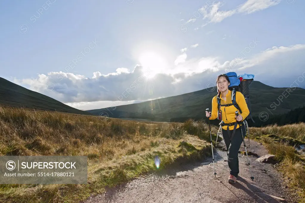 female hiker walking up towards Pen Y Fan in Wales