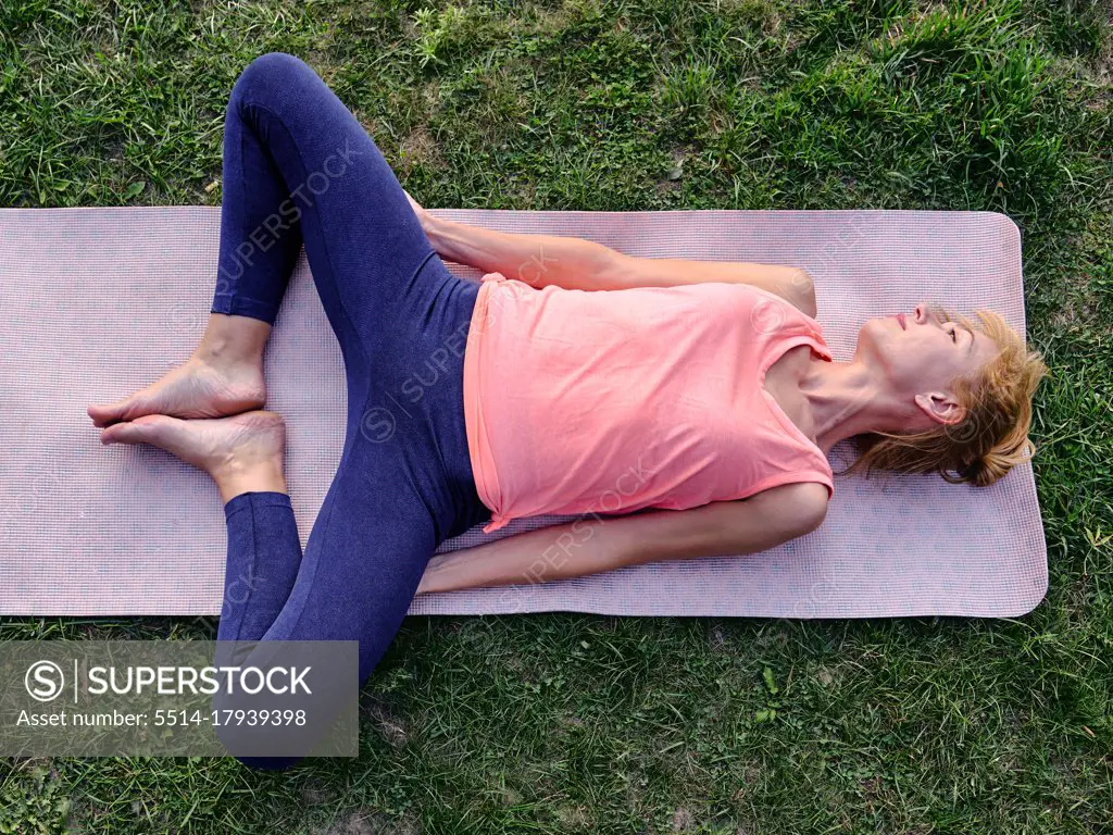 Female athlete stretching pelvis and hips