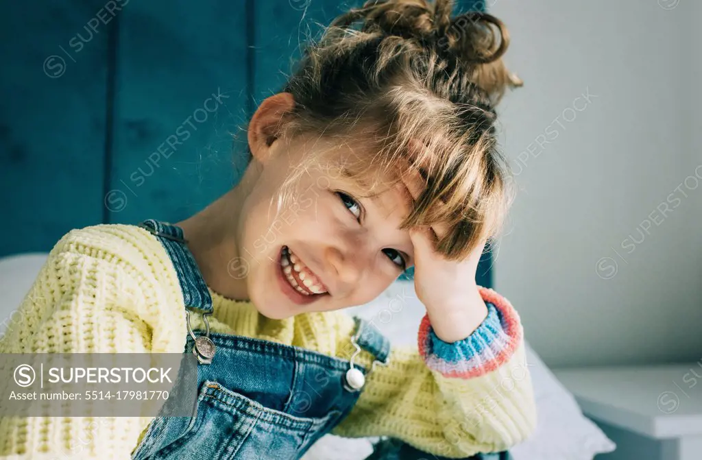 candid portrait of a beautiful young girl smiling full of happiness