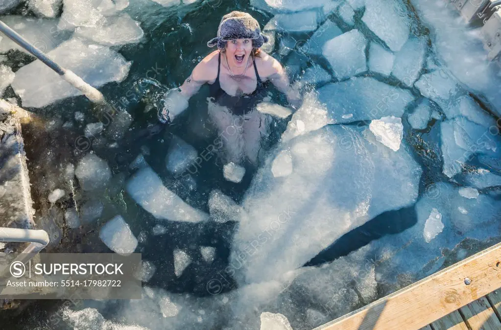 American Mid 40s Woman Excited To Be Swimming With Ice In Denmark