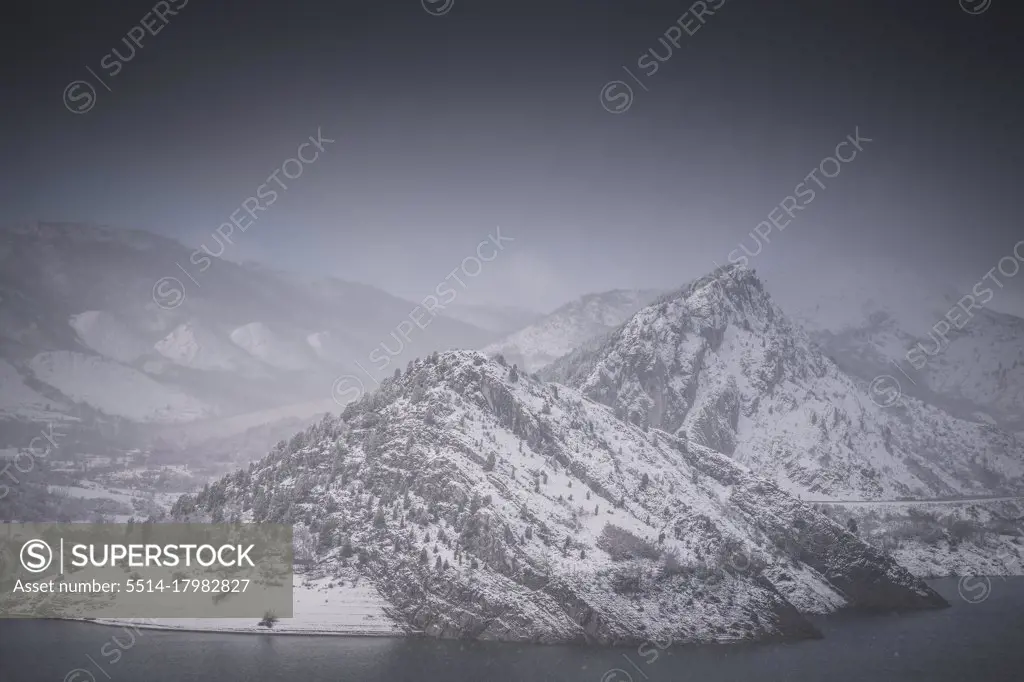 snow-capped mountains adjacent to reservoir