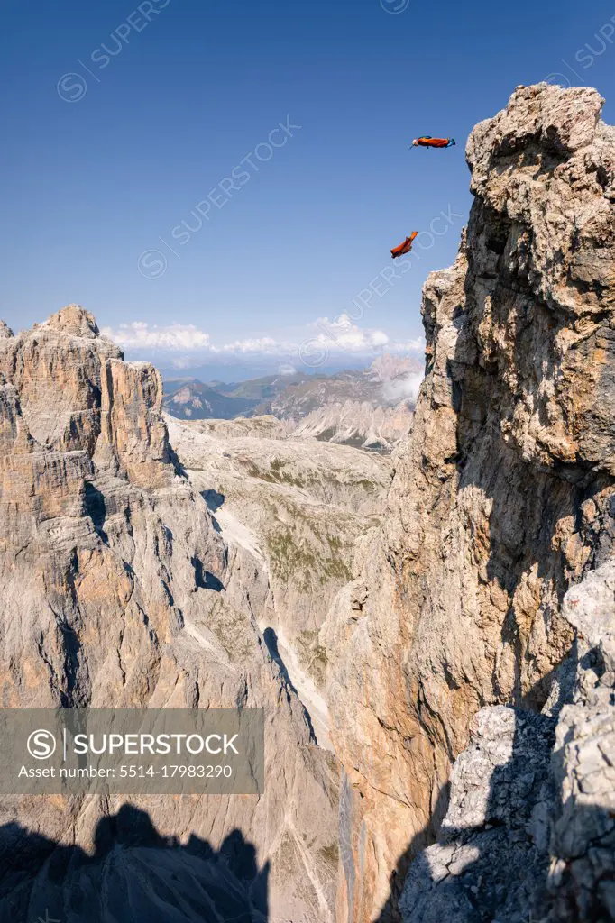 Wingsuit Base Jumpers jumping off a mountain