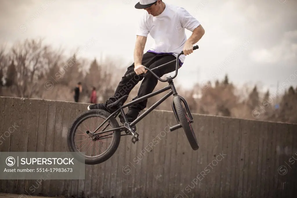 Young bmx rider trying to land trick