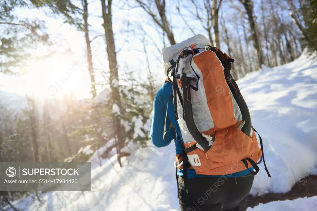 Male ice climber hiking up to Mount Washington, New Hampshire