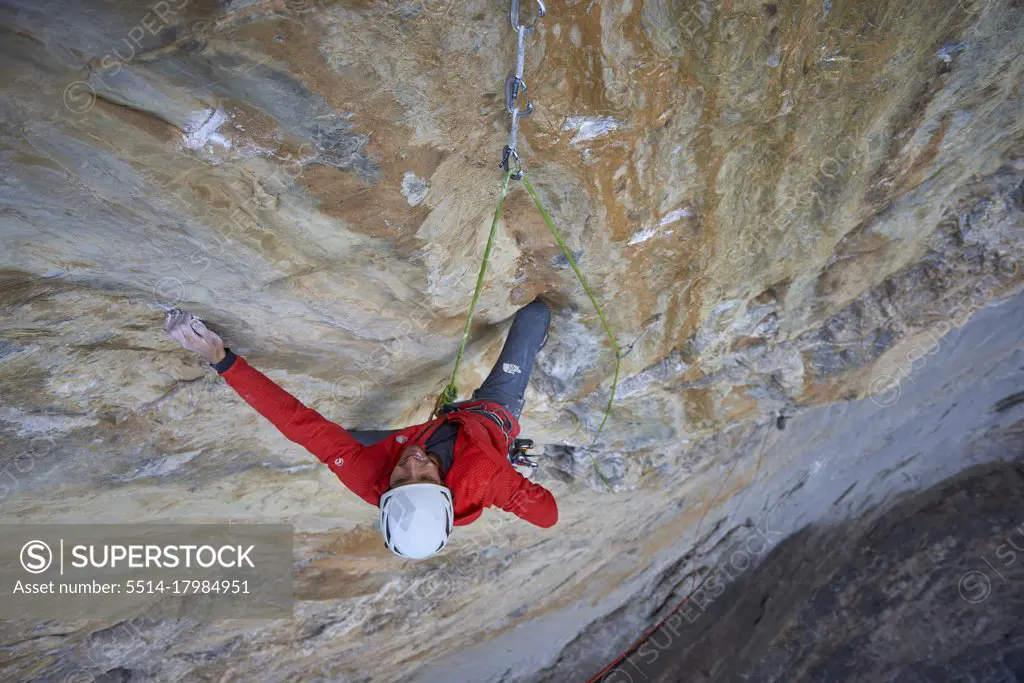 Man on a difficult rock climb called Odyssee on the Eiger North Face