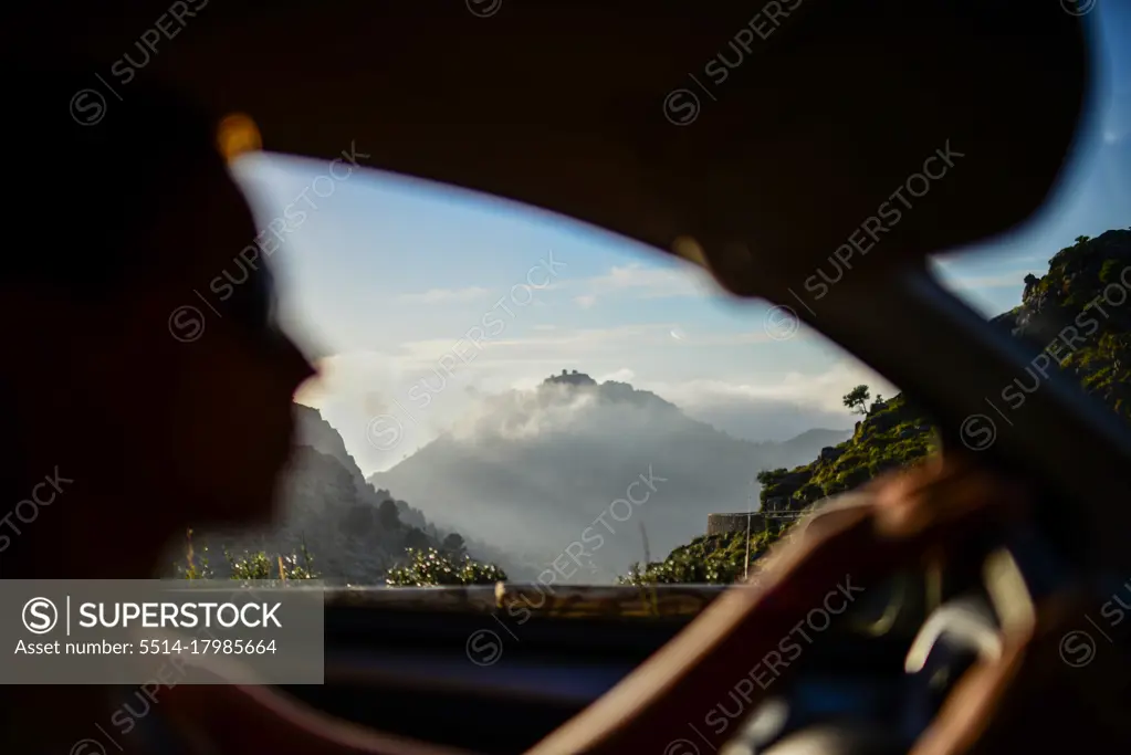 Silhouette of young woman driving in Mallorca