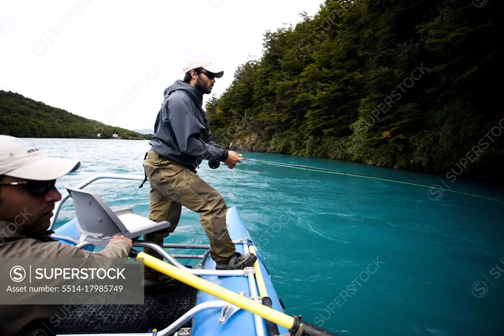 Two fisherman float down the Rio Baker in southern Chile in a region called Patagonia.