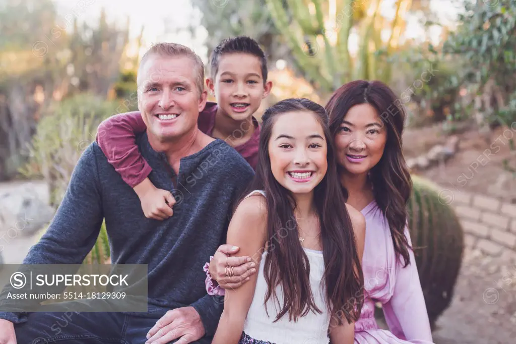 Asian and white mixed family - mother, father, son and daughter.