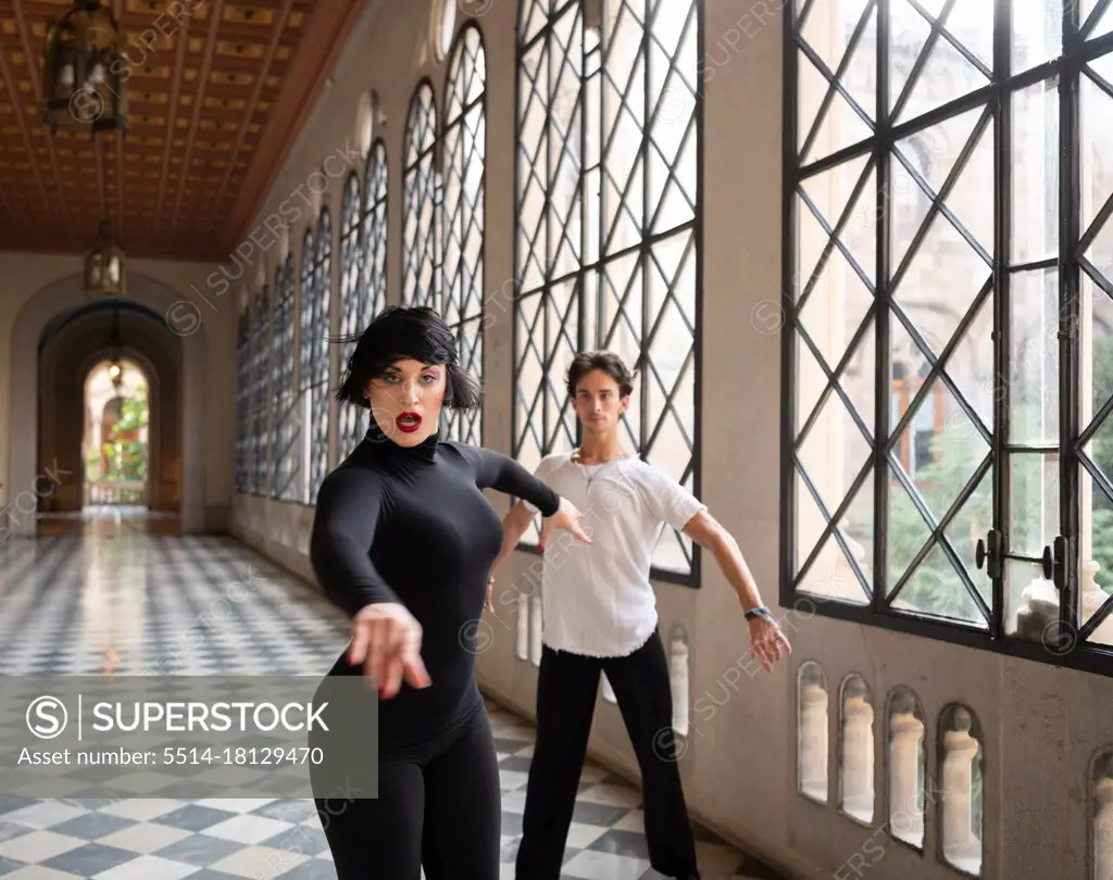 Woman dancing with man during rehearsal