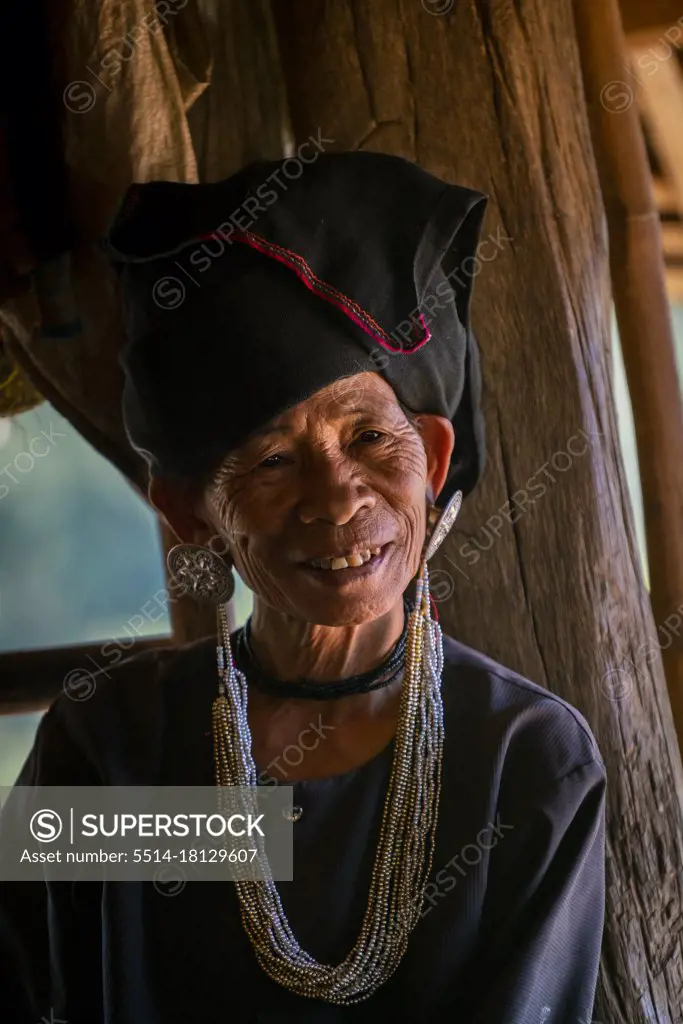 Portrait of smiling senior lady of Akhu tribe near Kengtung, Myanmar