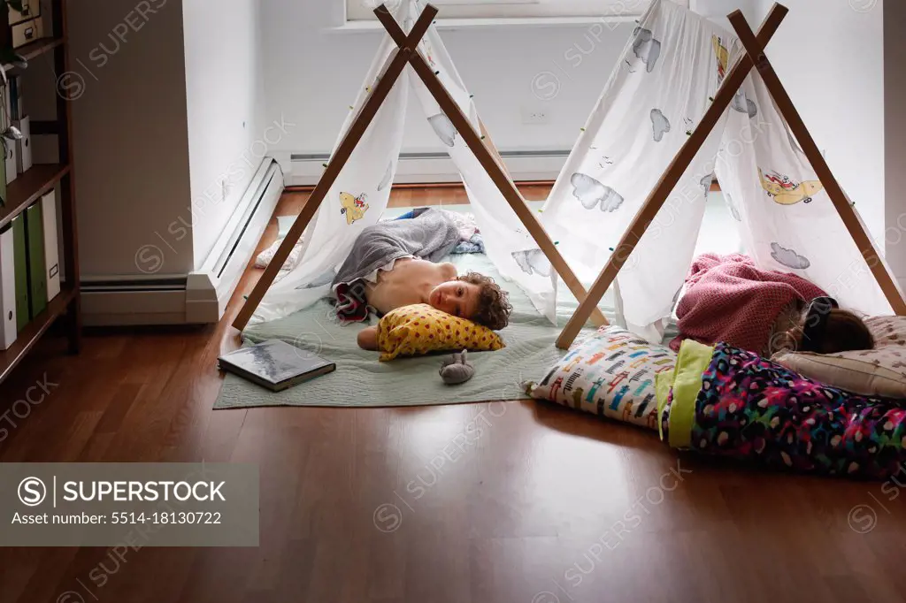 Two sleeping kids inside in tents