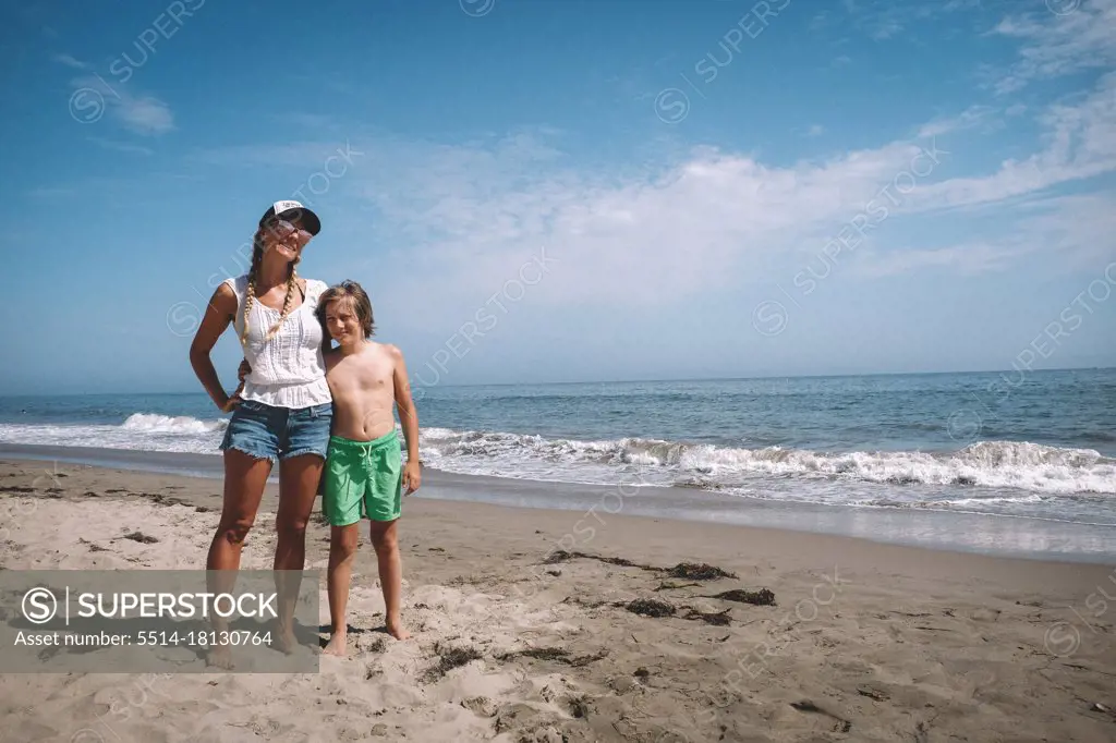 Mother and Son pose for a photo on a California Beach