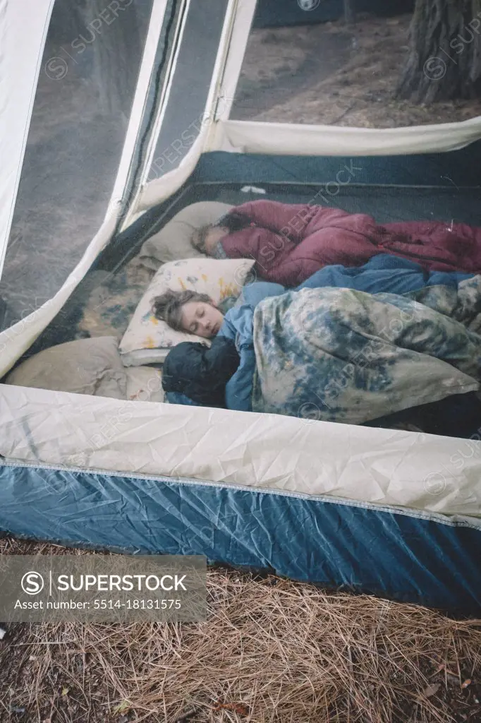 Two Boys Sleeping and cozy  in Fancy Camping Tent