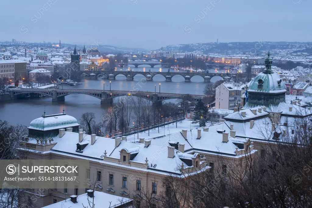 Bridges over Vltava river at dusk seen from Letna park in winter, Prague, Czech Republic