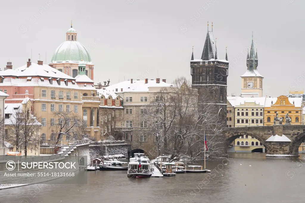 Old Town Bridge Tower and St. Francis of Assisi Church in winter, Prague, Czech Republic