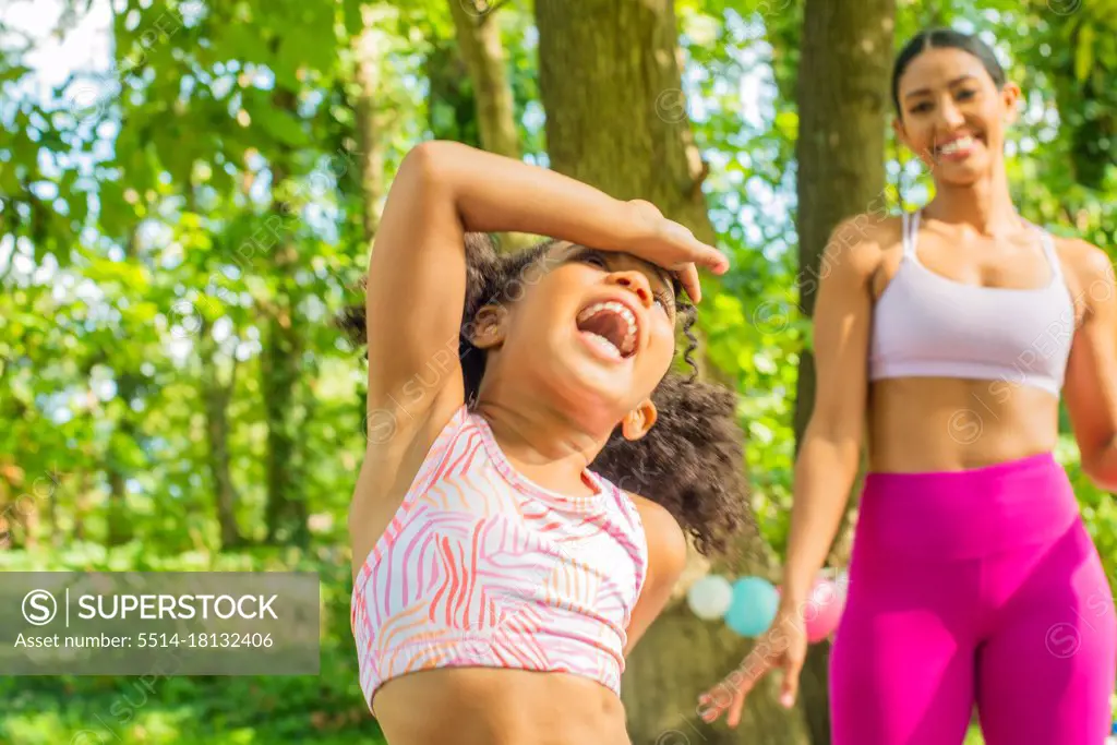 Child laughs after yoga stretch