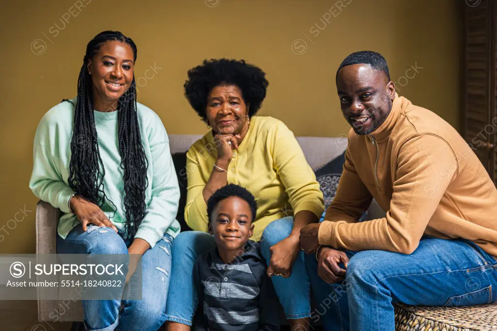 Portrait of smiling multi-generational family at home