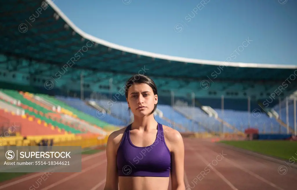 Female athlete during workout on stadium