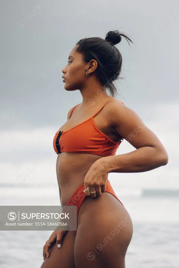 Beautiful african american woman in black bikini at the beach Stock Photo