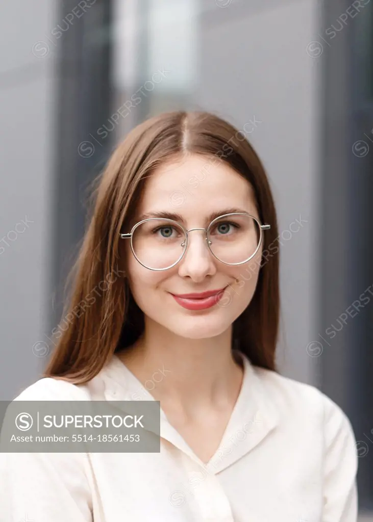 young woman in business clothes near her office