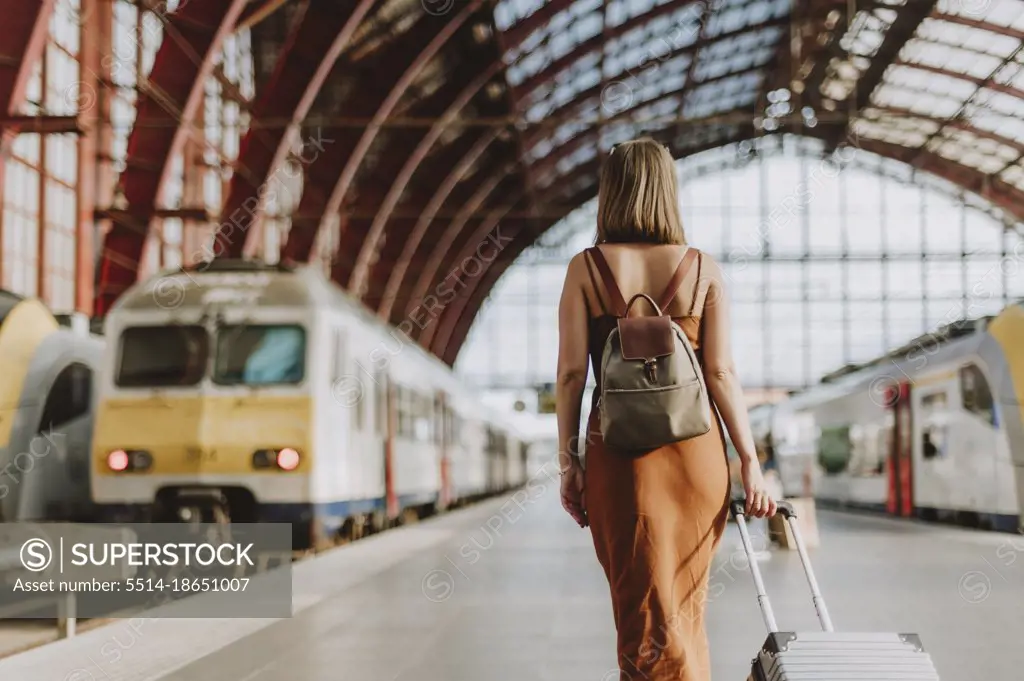 Tourist woman walking inside the train station in Antwerp