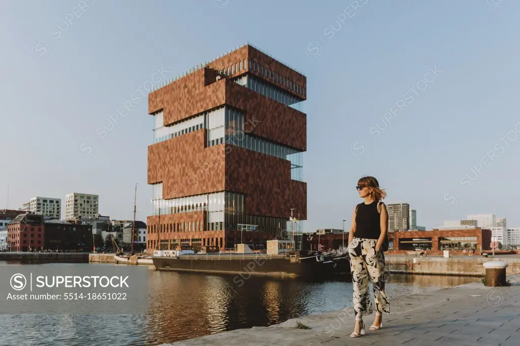 Tourist woman walking at the Willem Dock Marina, Antwerp, Flanders