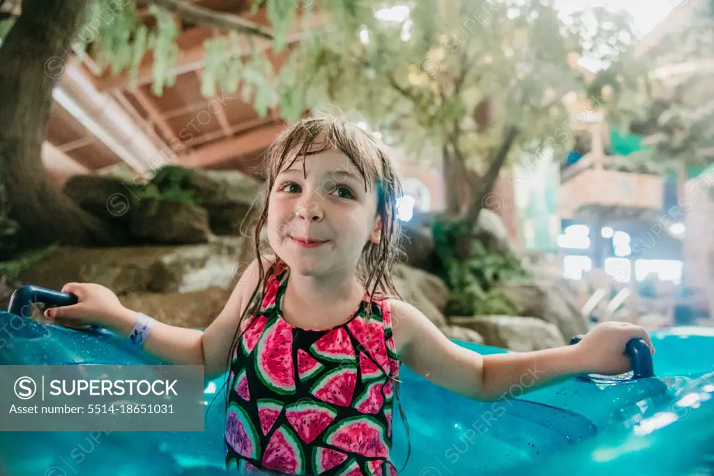 Girl on lazy river at water park