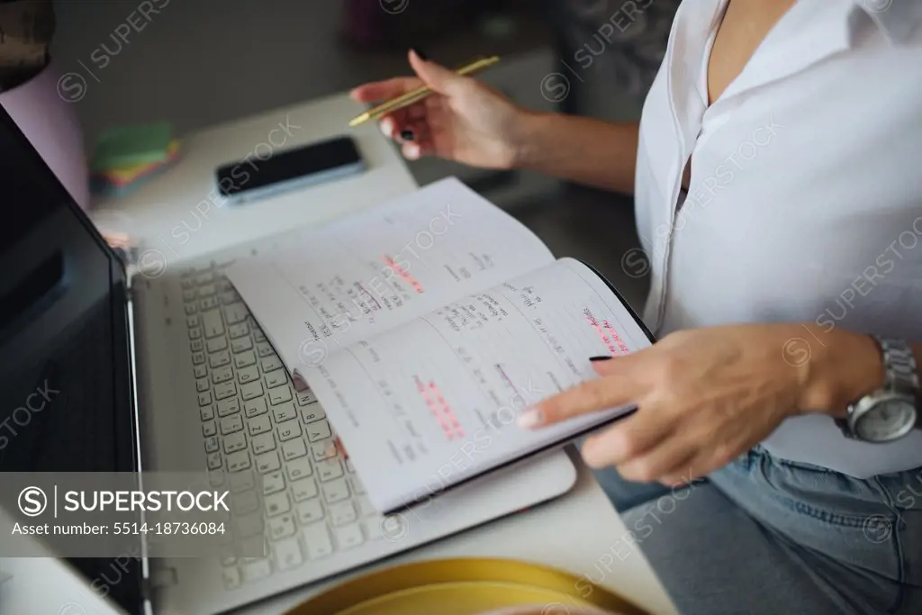 Close-up of a woman chekcing her to do list.