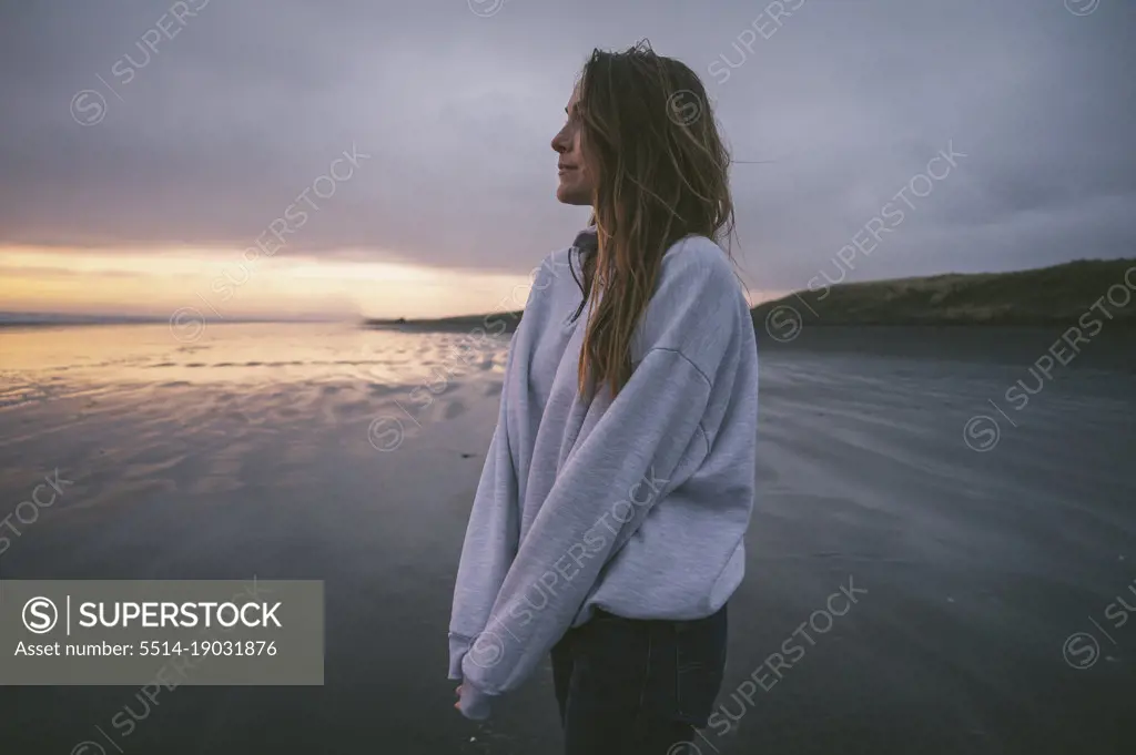 Female on the coast with dramatic sky