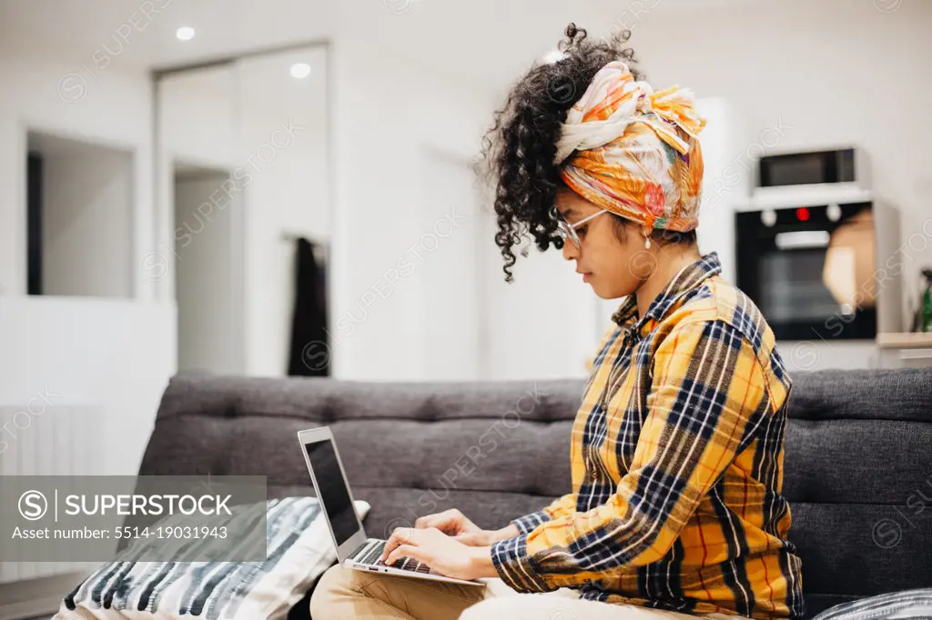 businesswoman working from home with her laptop