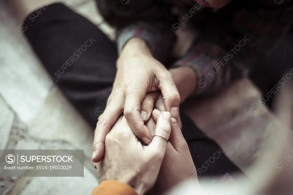 Three person soft and tender handhold