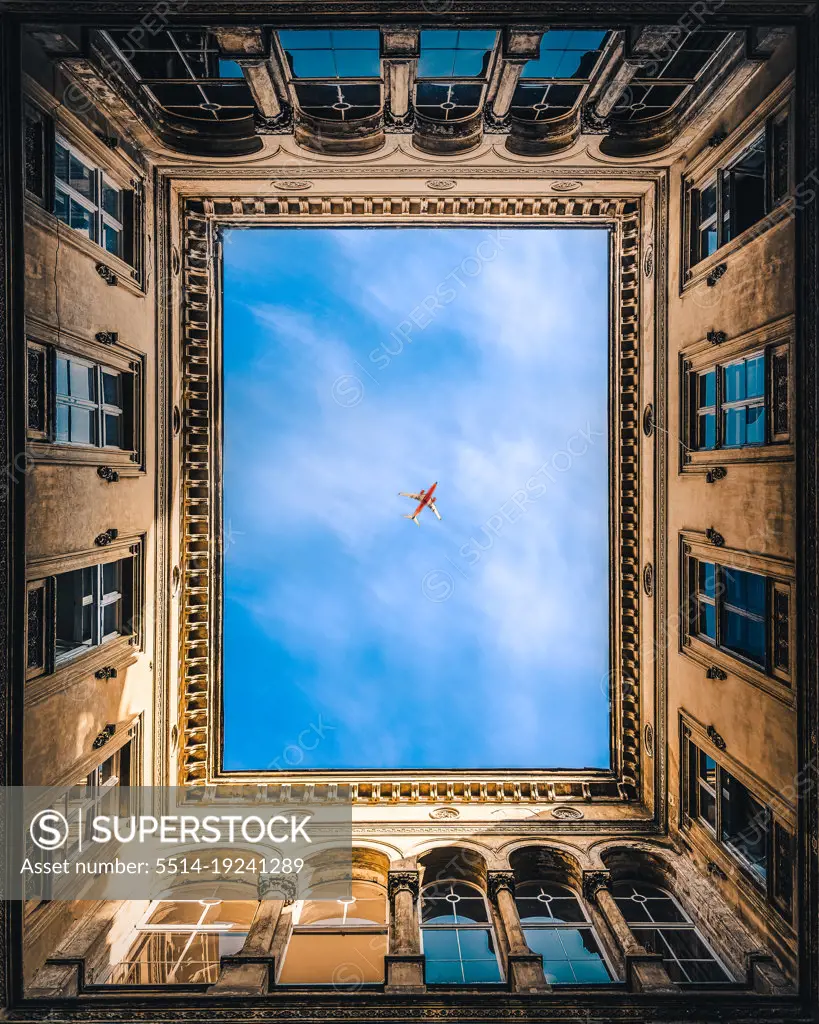 Airplane framed by buildings in Budapest, Hungary